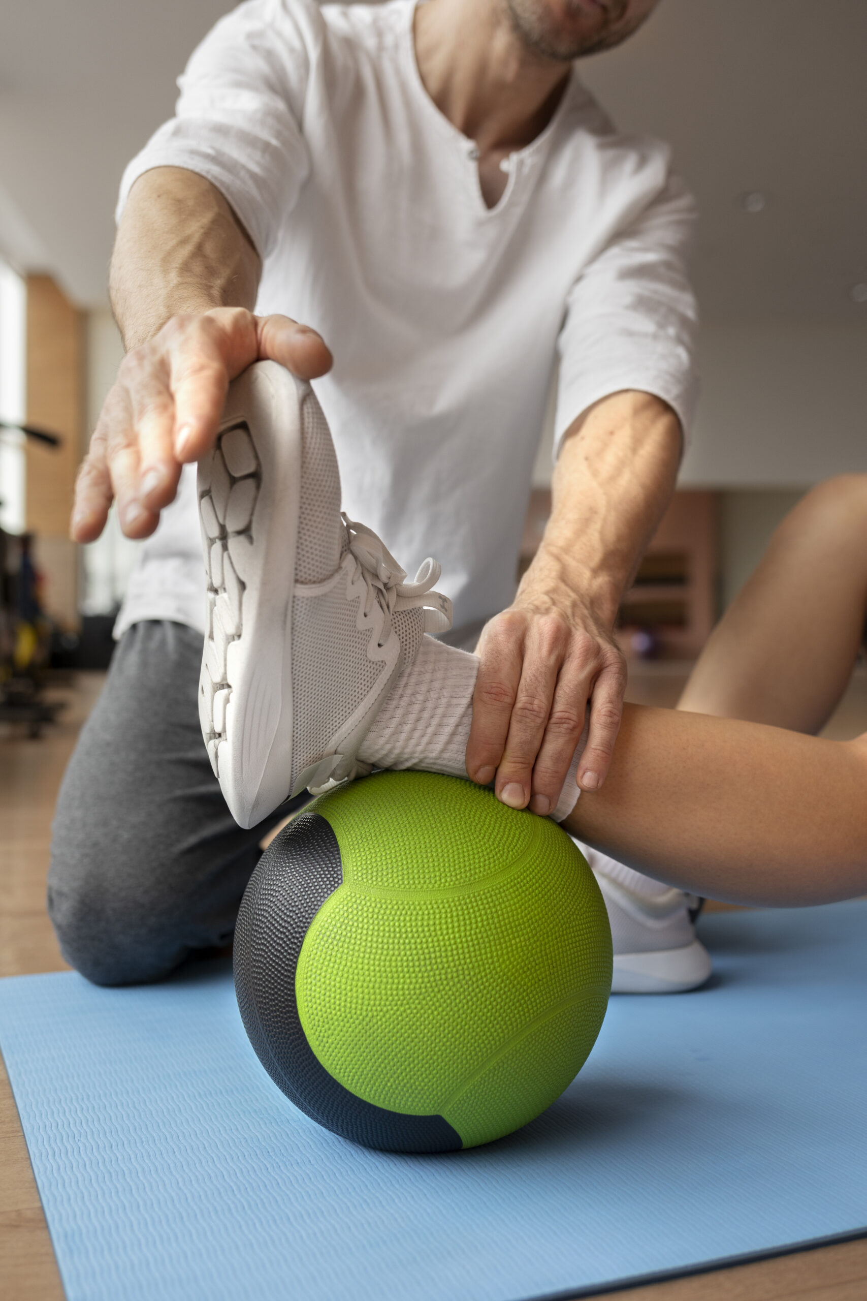patient-doing-physical-rehabilitation-helped-by-therapists